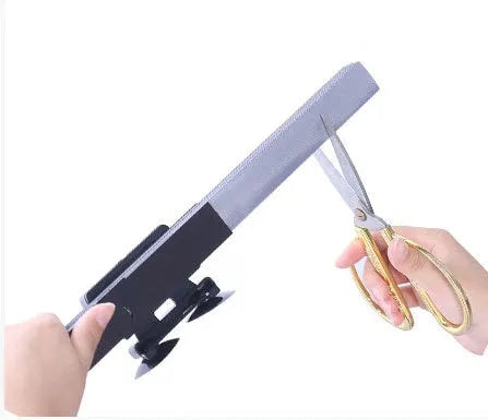 Car sun visor of aluminised film measuring 46cm sliding into position on a car windscreen
