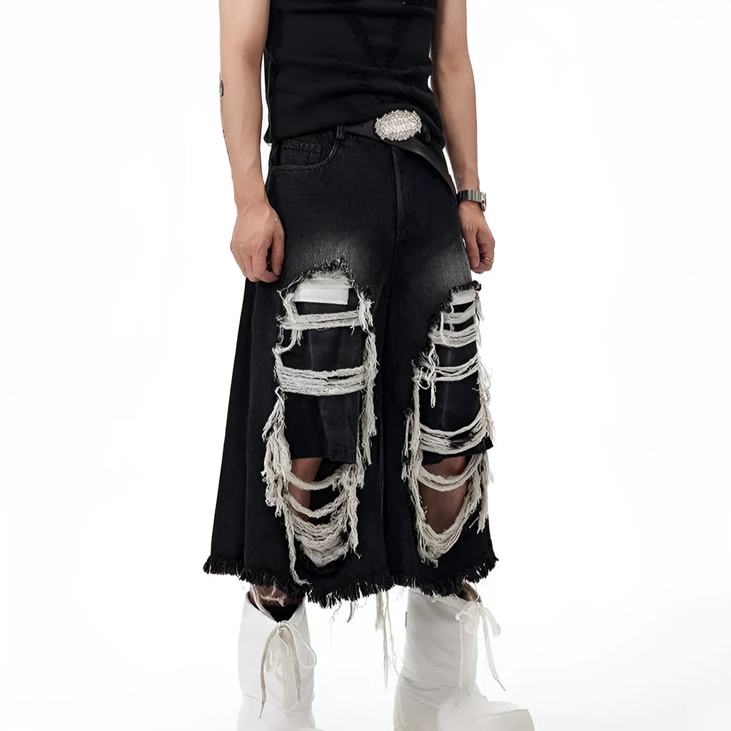 Black wide-leg cropped jeans with ripped patch details on a mid-high waist, loose fit.