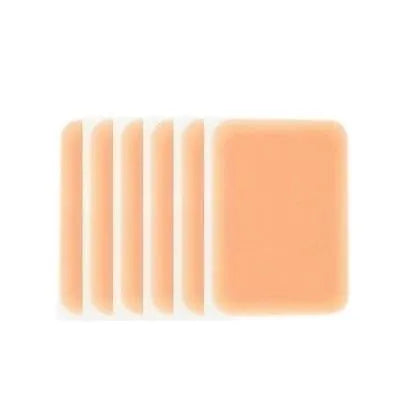 Pack of adhesive tattoo cover patches in various flesh tones on skin, showing 130mm length.