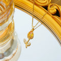 Gold-coloured tulip flower necklace on an adjustable O‑ring chain, shown in one of five colour options.