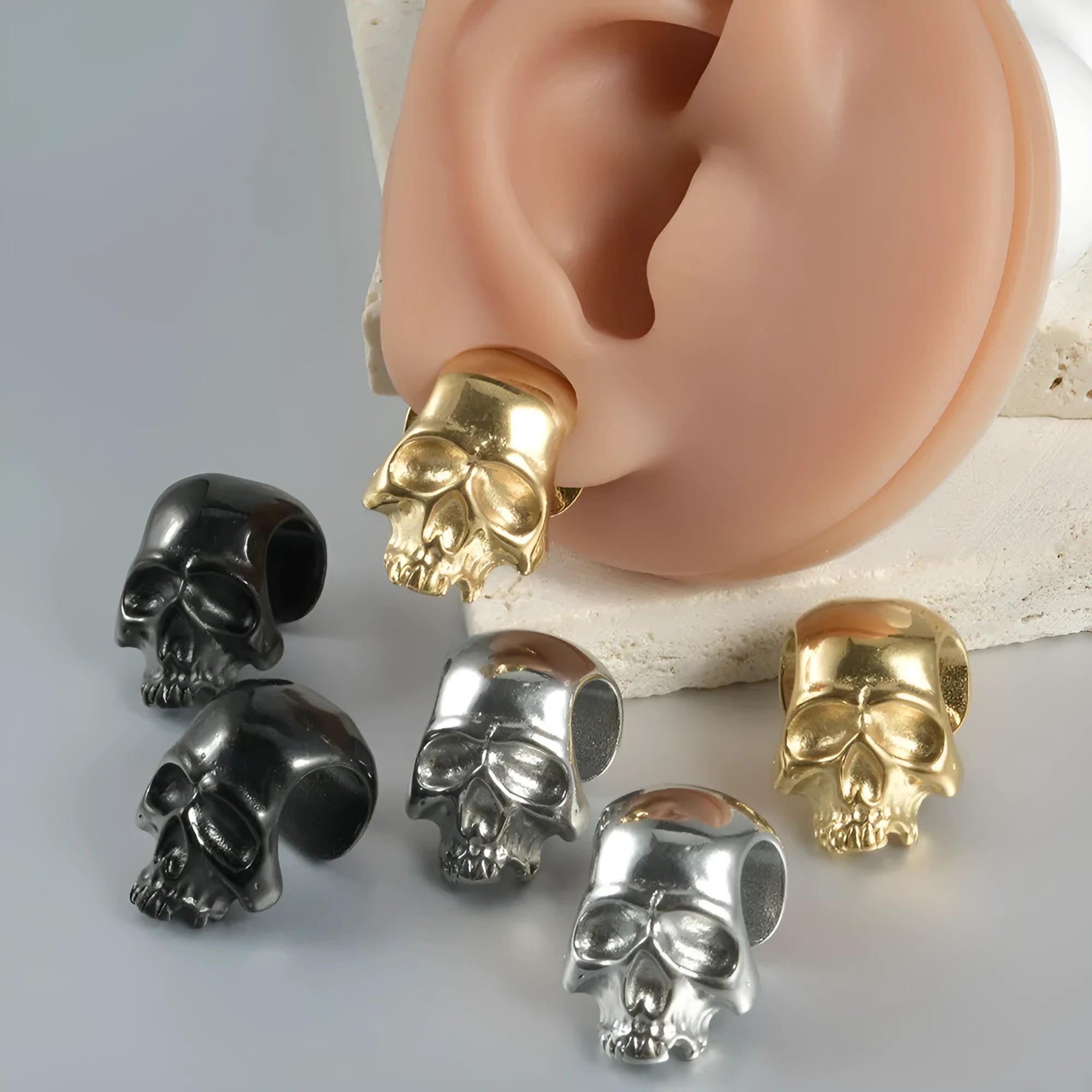 Stainless steel hollow skull Buddha earrings with electroplated colour options