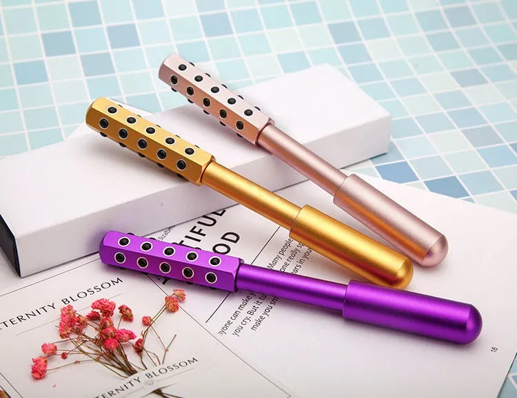Germanium particles facial massage roller in purple colour, approximately 193mm long