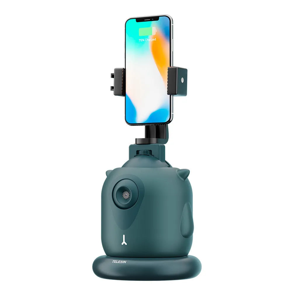 Dark green intelligent AI face tracking gimbal with 360 rotation on a desk