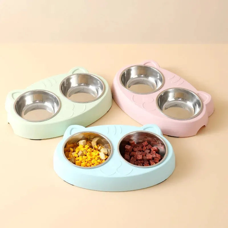 Blue macaron-shaped plastic pet feeder tray with two bowls for cat or small dog food and water.