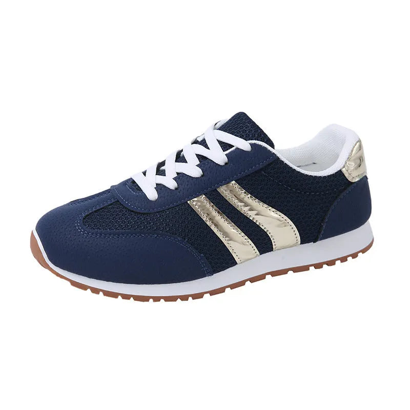 Blue women's casual tennis shoes with cross straps and non-slip rubber sole