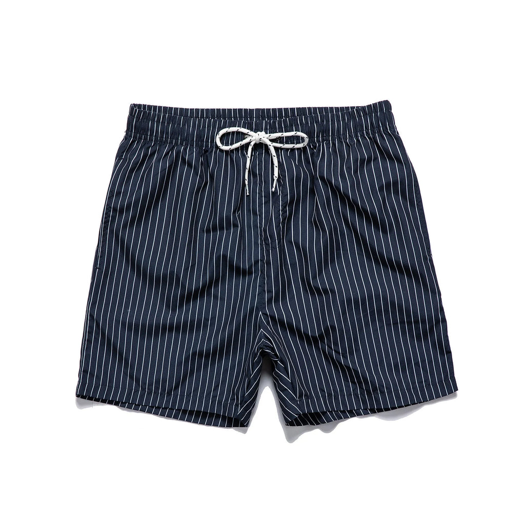 A pair of striped beach shorts in a light blue colour with a straight leg opening, laid flat.