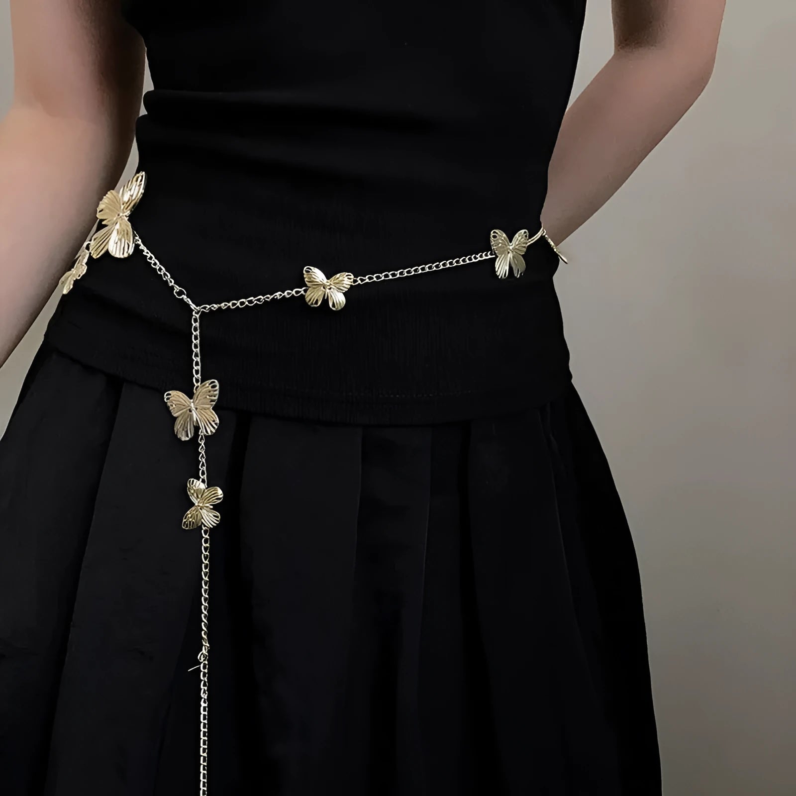 Gold and silver alloy waist chain with butterfly design measuring 104cm length
