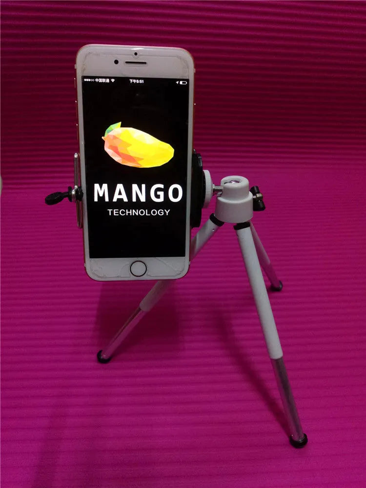 Black aluminium alloy desktop phone holder with an adjustable two-section bracket holding a smartphone.