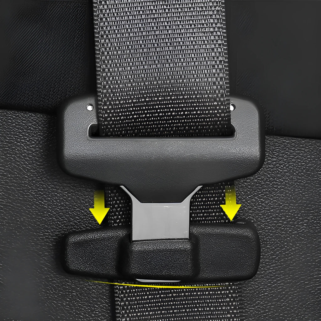Two black ABS plastic universal seatbelt stopper clips shown next to a car seatbelt.