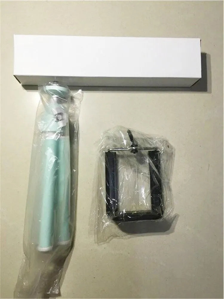 Black aluminium alloy desktop phone holder with an adjustable two-section bracket holding a smartphone.