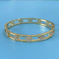 Gold and silver hollow women's bracelets with four-leaf clover charm and zircon stones.