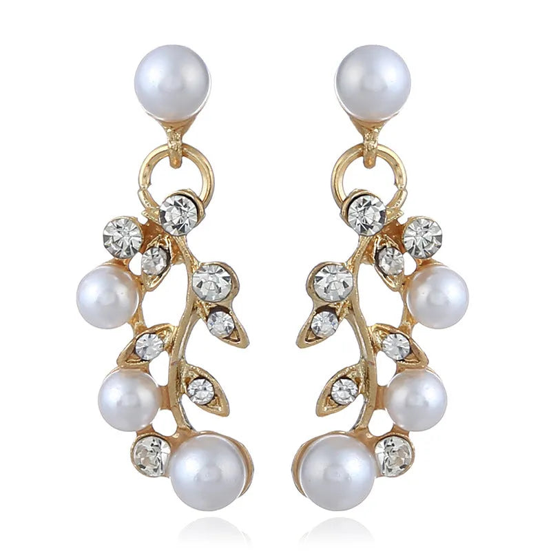 Fashion chain set with earrings and necklace featuring simulated pearl and diamond accents in silver tone