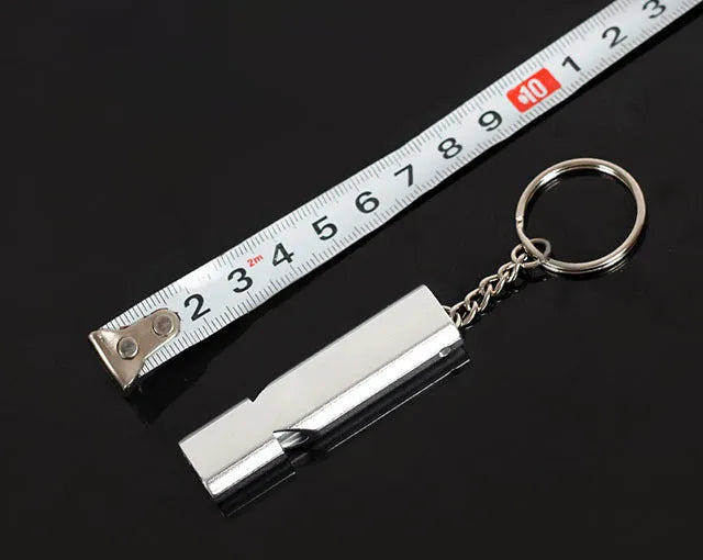 Silver and gold aluminium alloy double hole outdoor survival whistle.