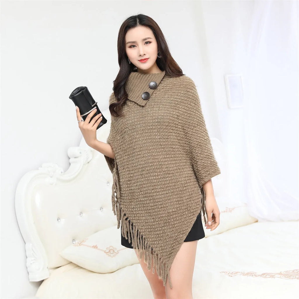 Women's sleeveless knitted cloak shawl with dot pattern in apricot colour