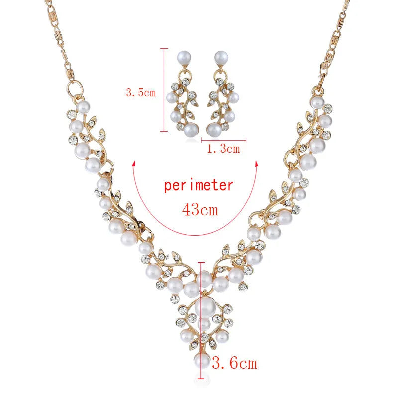 Fashion chain set with earrings and necklace featuring simulated pearl and diamond accents in silver tone