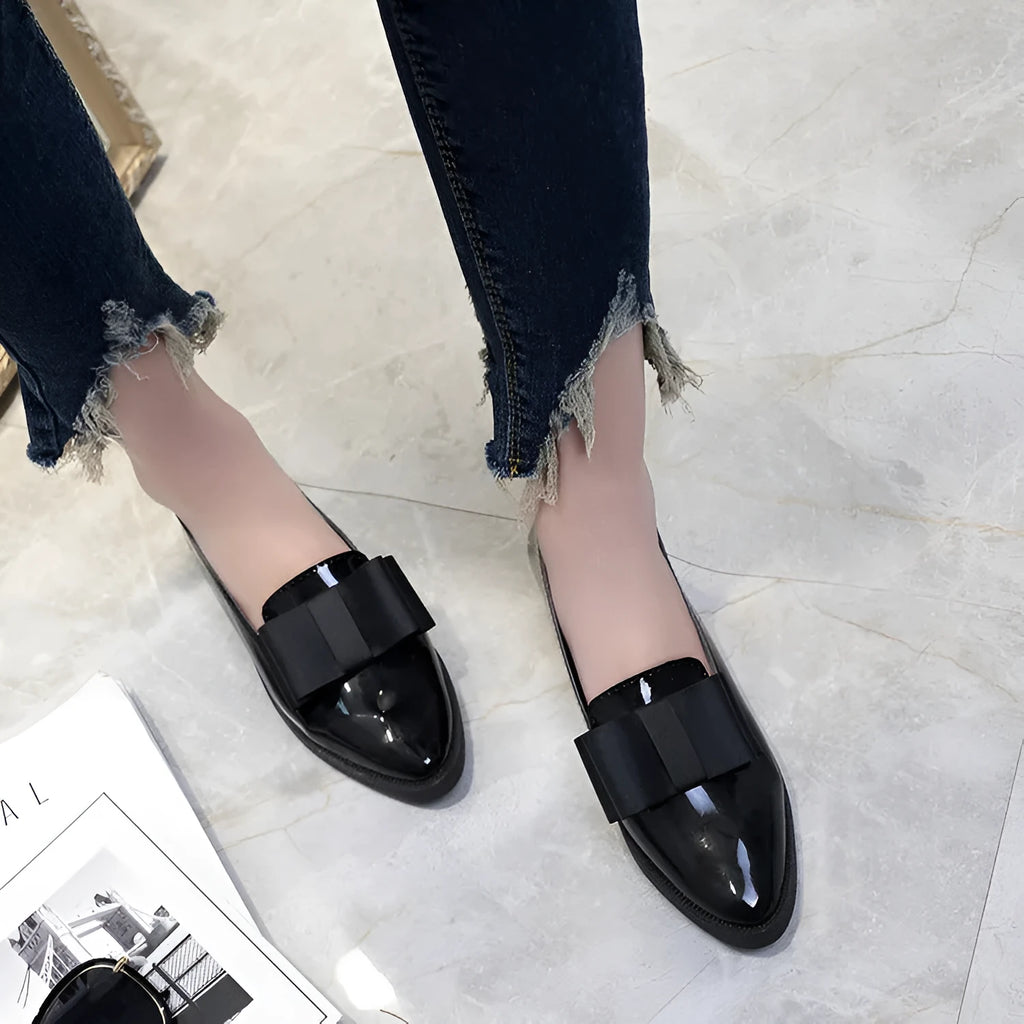 Women's patent leather bowtie flat loafers with pointed toe and low heel in black and claret