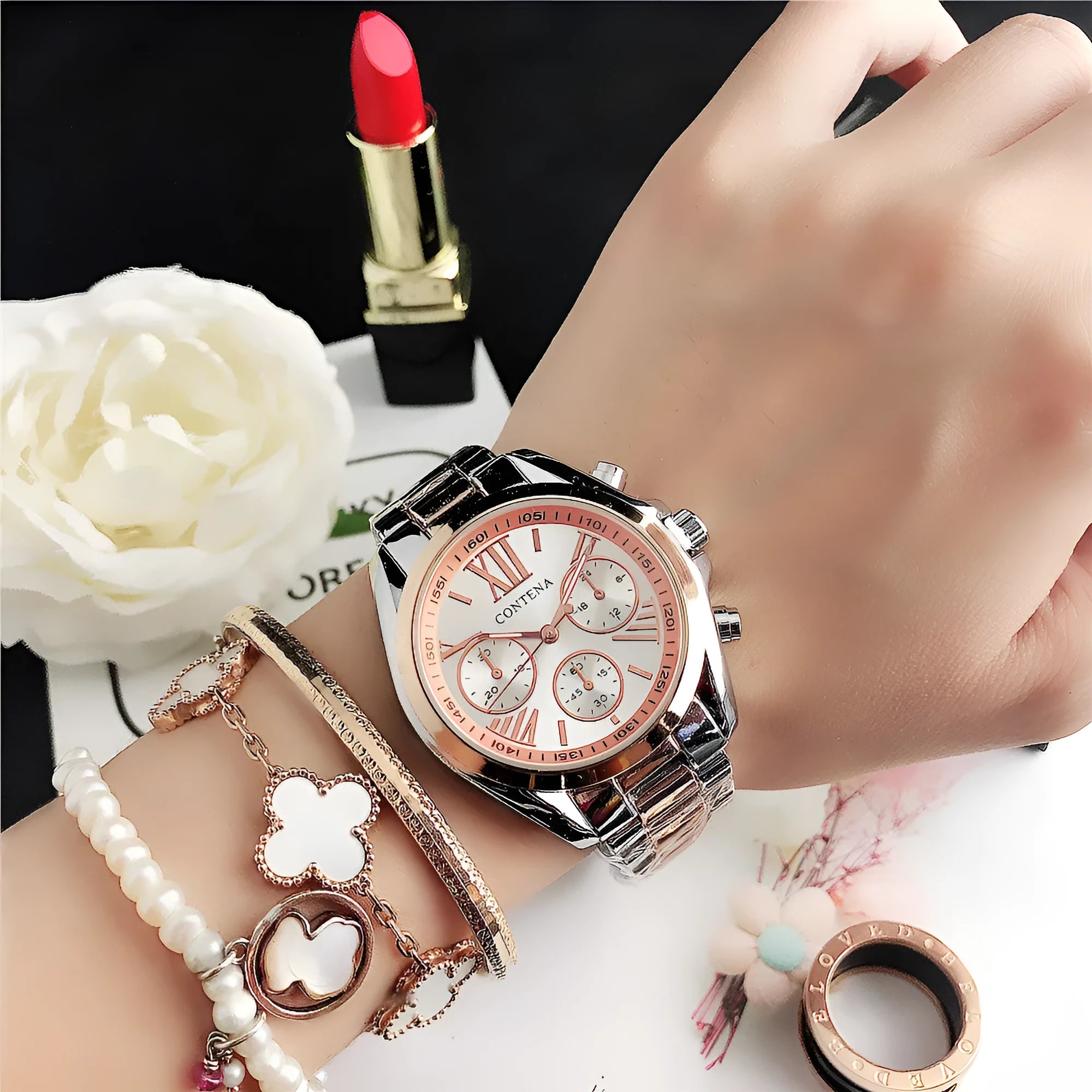Women's silver and rose gold mesh strap watch with diamond quartz movement and pointer display