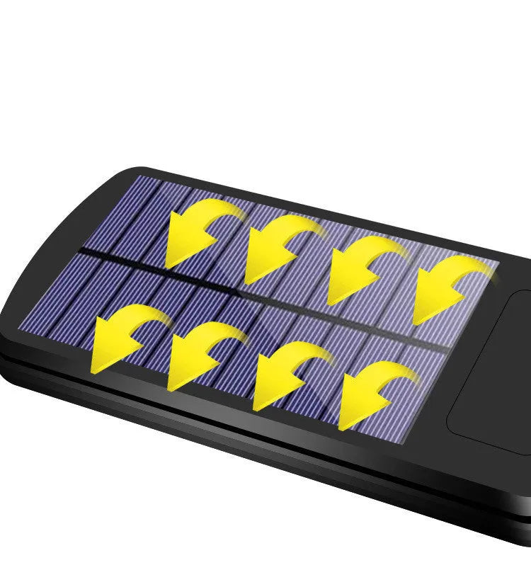 Black outdoor solar motion sensor wall light mounted on fence with LED illumination