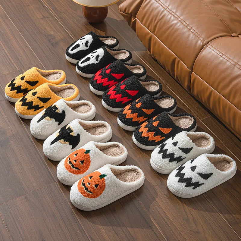Halloween couple slippers with black and orange ghost face embroidery on suede upper and PVC sole.