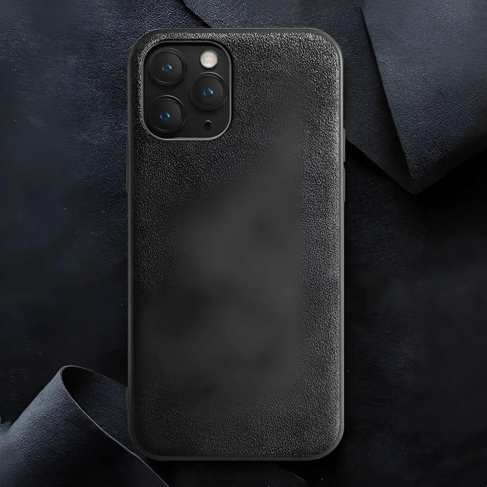Suede luxury back case for iPhone on a dark background, shown in elegant black, dark night green, and dark blue colours.
