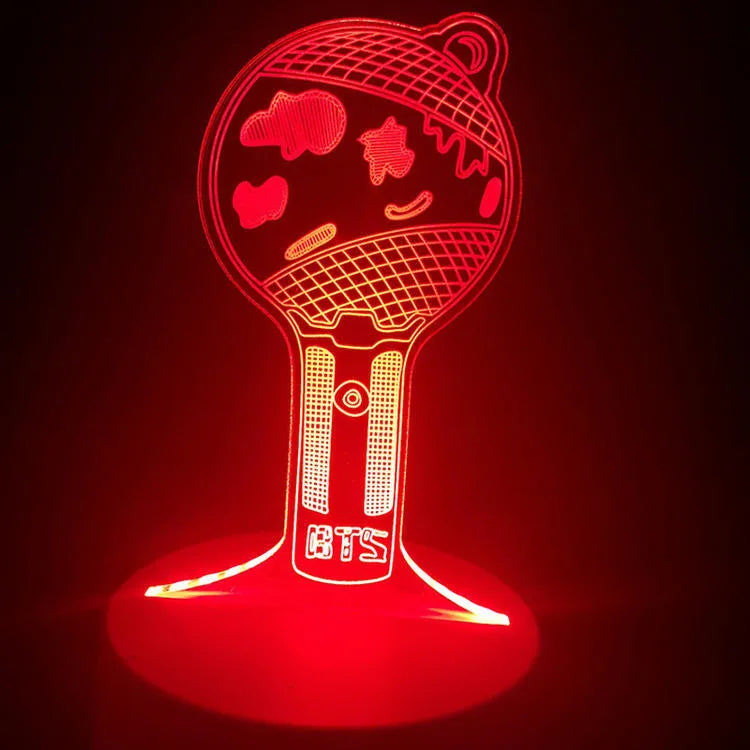 Clear acrylic display stand supporting 101 Tower Gem BTS lamp with universal voltage compatibility