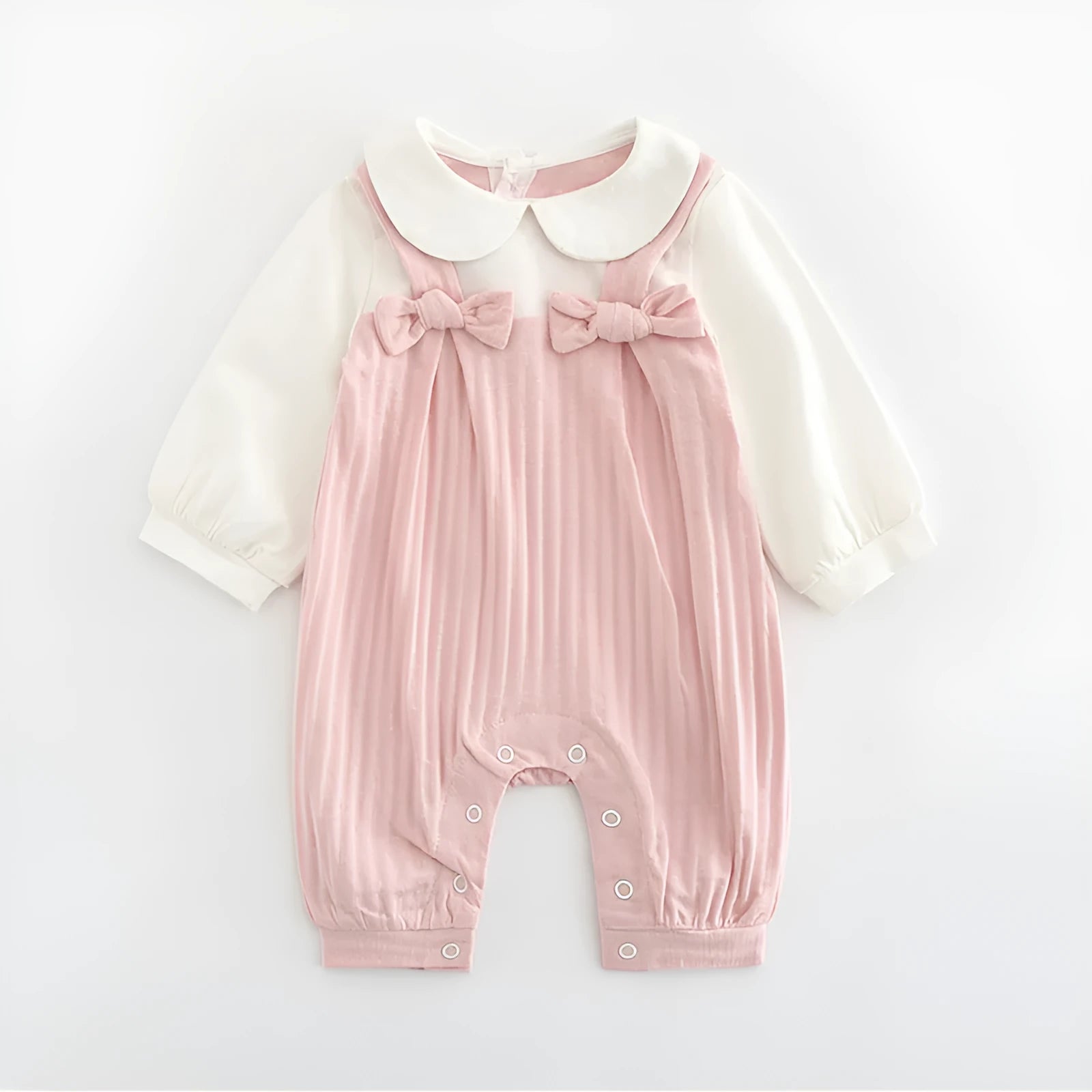 Pink baby girl's embroidered long sleeve cotton jumpsuit on a hanger
