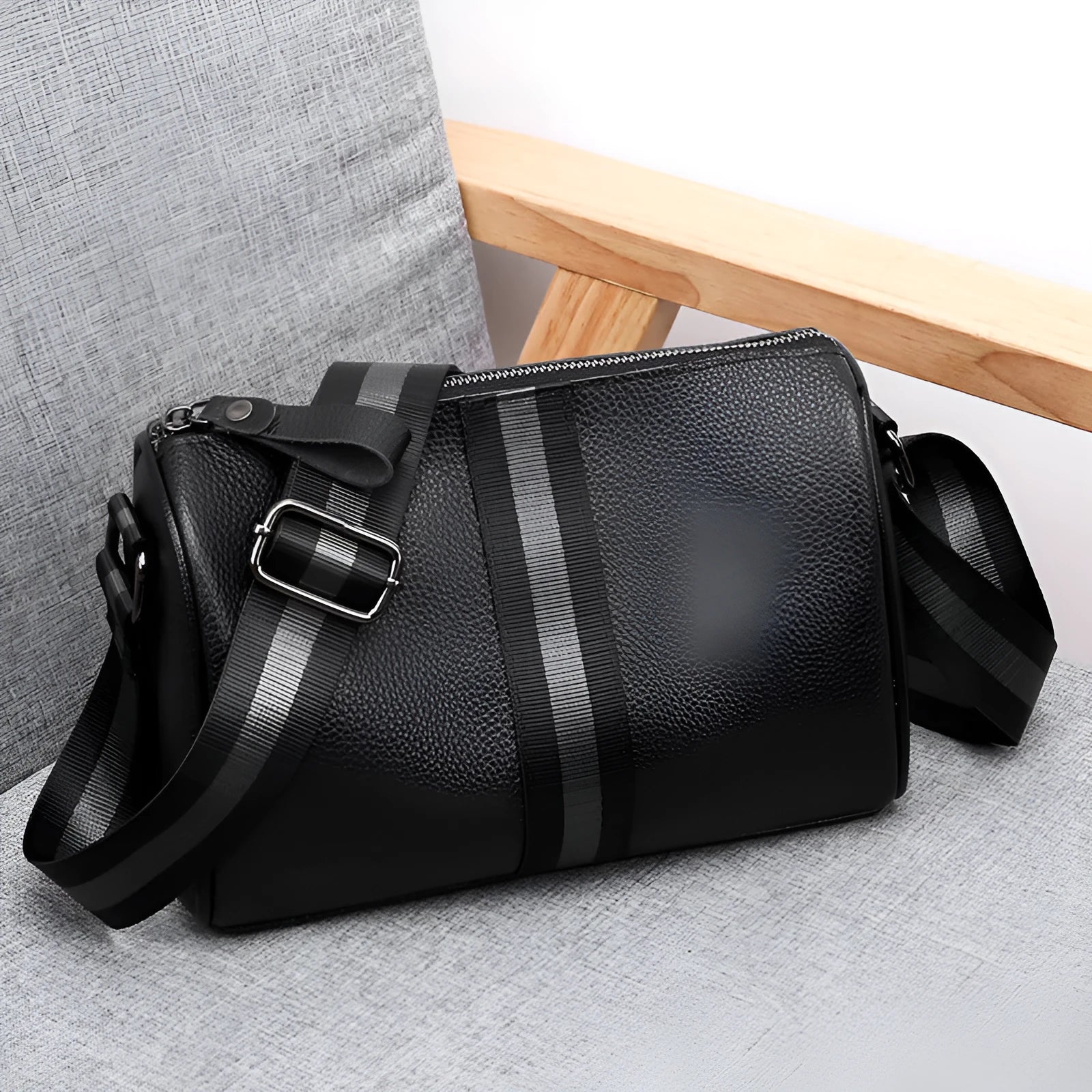 Black genuine leather one-shoulder crossbody bag showing front view and dimensions