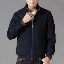 Men's grey polyester fleece jacket with long sleeves and side pockets shown in sports style