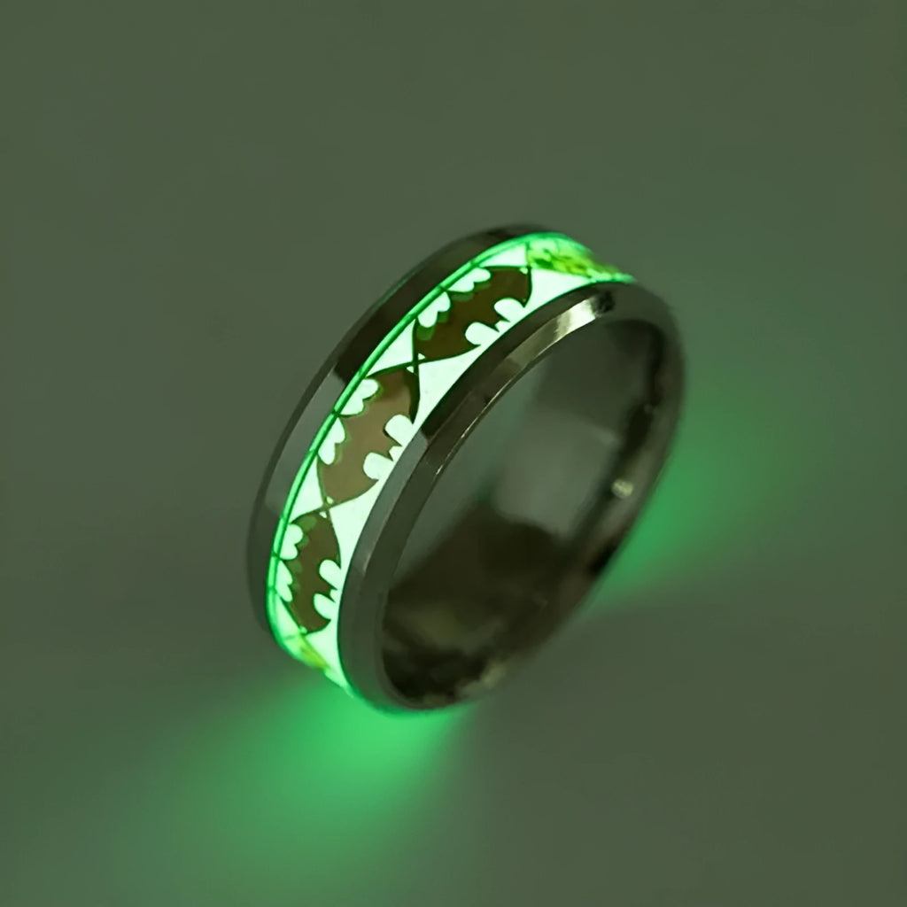 Stainless steel Batman ring with luminous glow in the dark finish in silver colour on a black background
