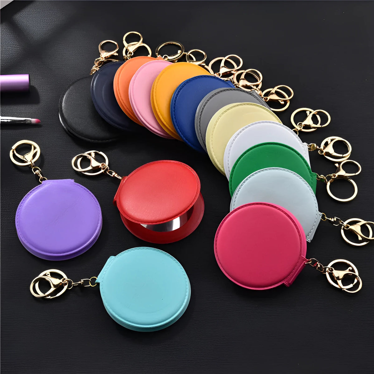 Small round makeup mirror with PU leather frame and golden buckle in 8cm size