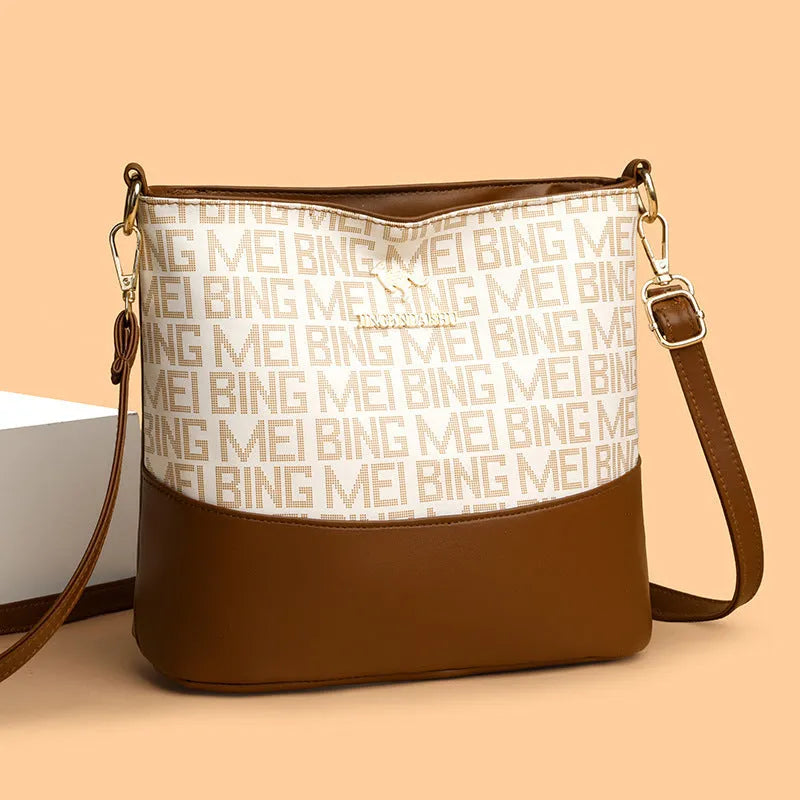 Brown soft leather messenger bag with front pocket and shoulder strap