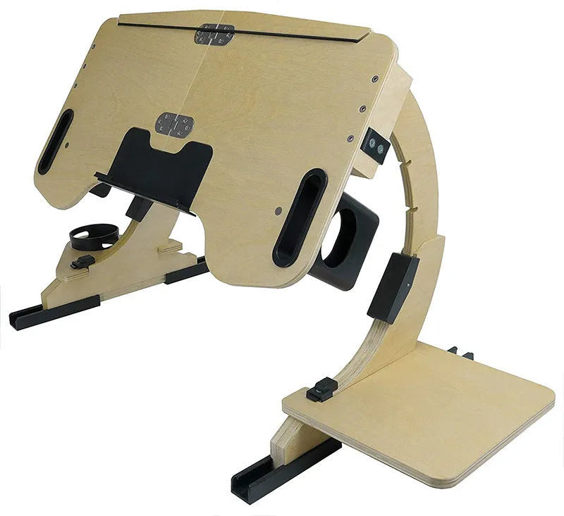 White wooden folding computer desk with adjustable angle, shown on a bed.