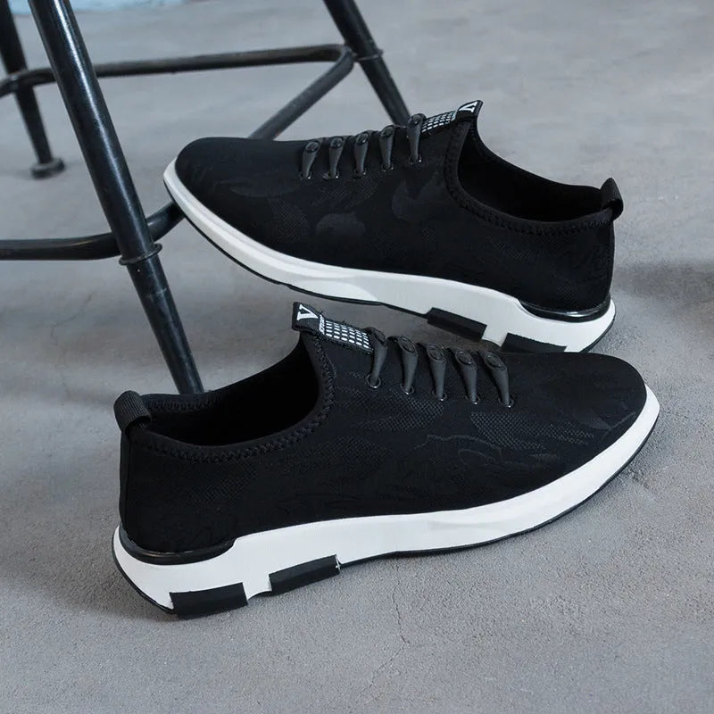 Men's breathable Lycra casual shoes in black with slip-on design, round toe, and flat rubber sole