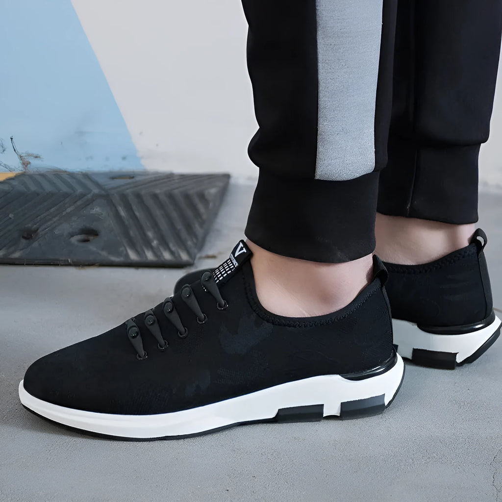 Men's breathable Lycra casual shoes in black with slip-on design, round toe, and flat rubber sole
