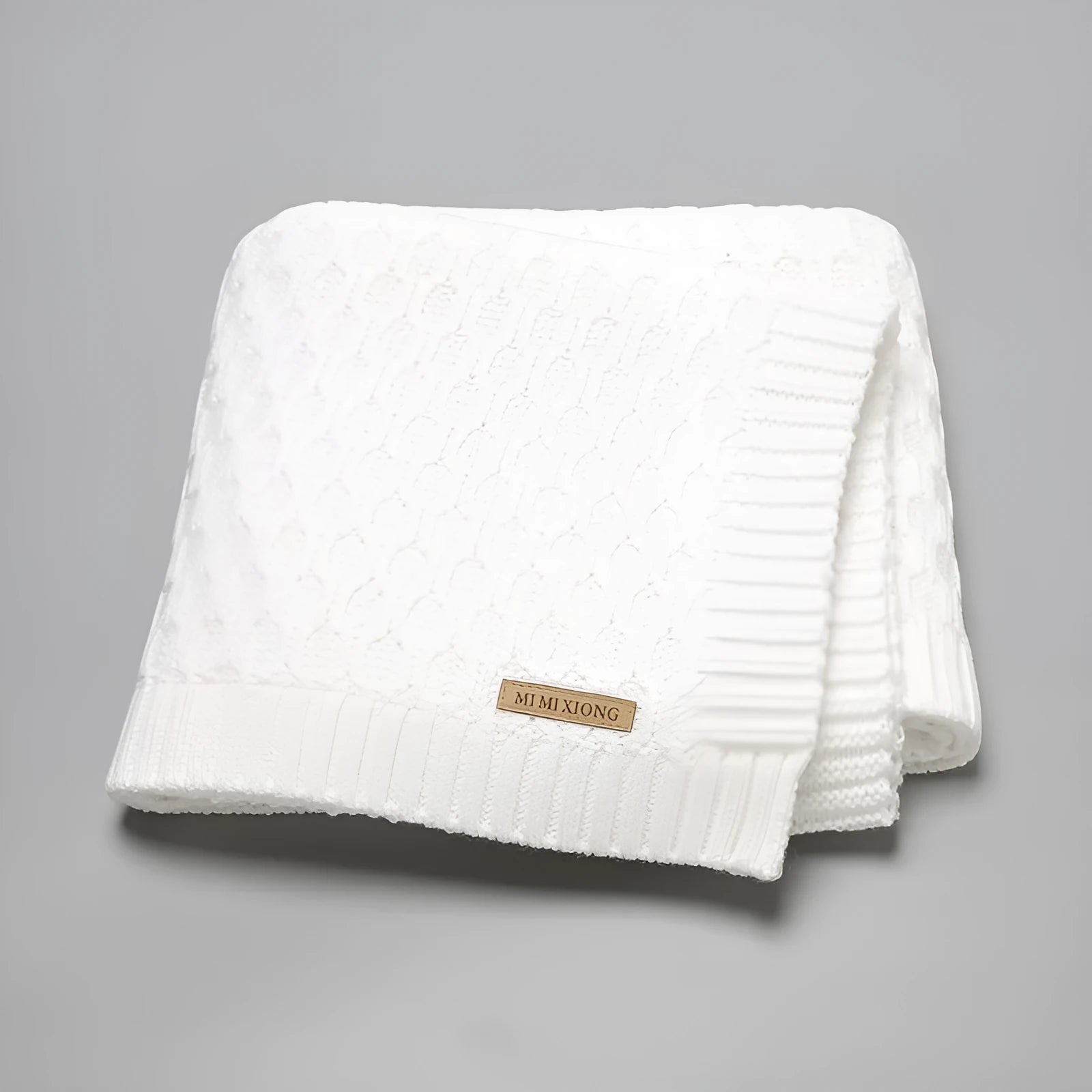 Solid colour infant hug blanket with three-dimensional lines texture showing 70×90cm dimensions