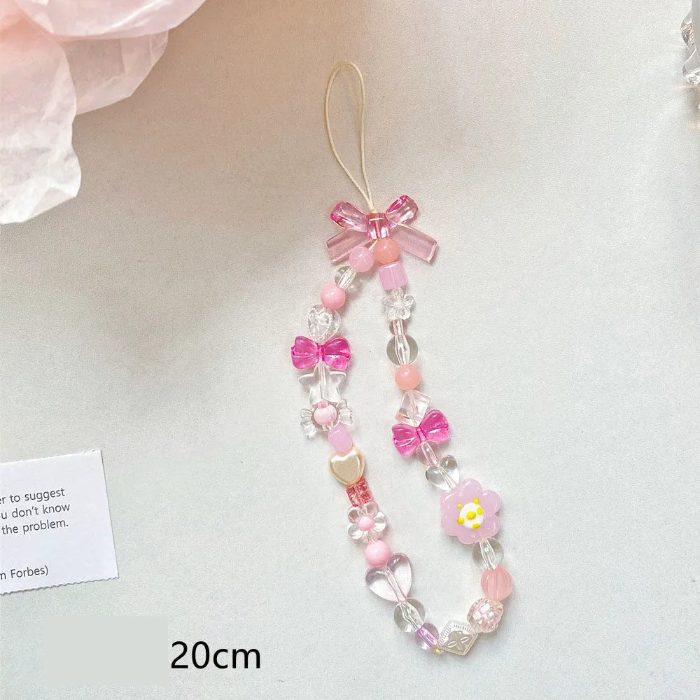 Beaded flower mobile phone lanyard with adjustable sliding bead in blue, pink, and yellow colour options