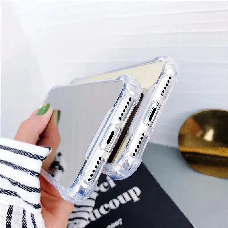 Mirror finish iPhone case with reflective surface showing TPU flexible construction and precise port cutouts
