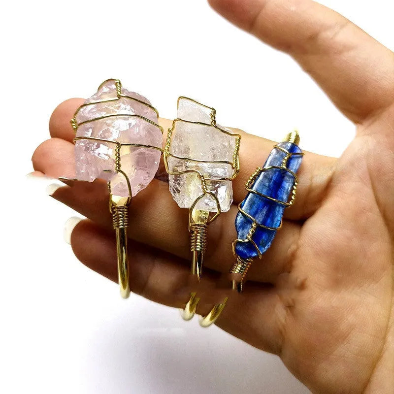 Natural rough stone crystal bracelet with gold winding in a geometric bohemian style.