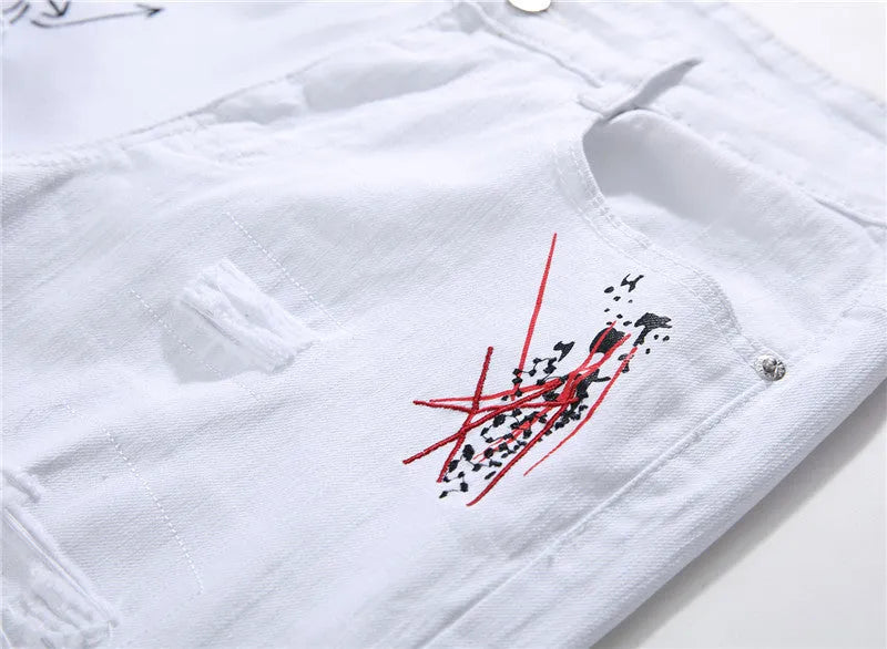 White shredded embroidery jeans in cotton denim, sizes 29-38, with ripped and embroidered details.