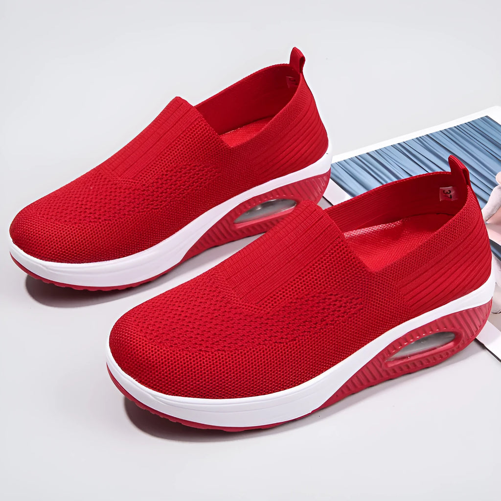 Women's mesh running shoes in beige with round toe and air cushion sole.