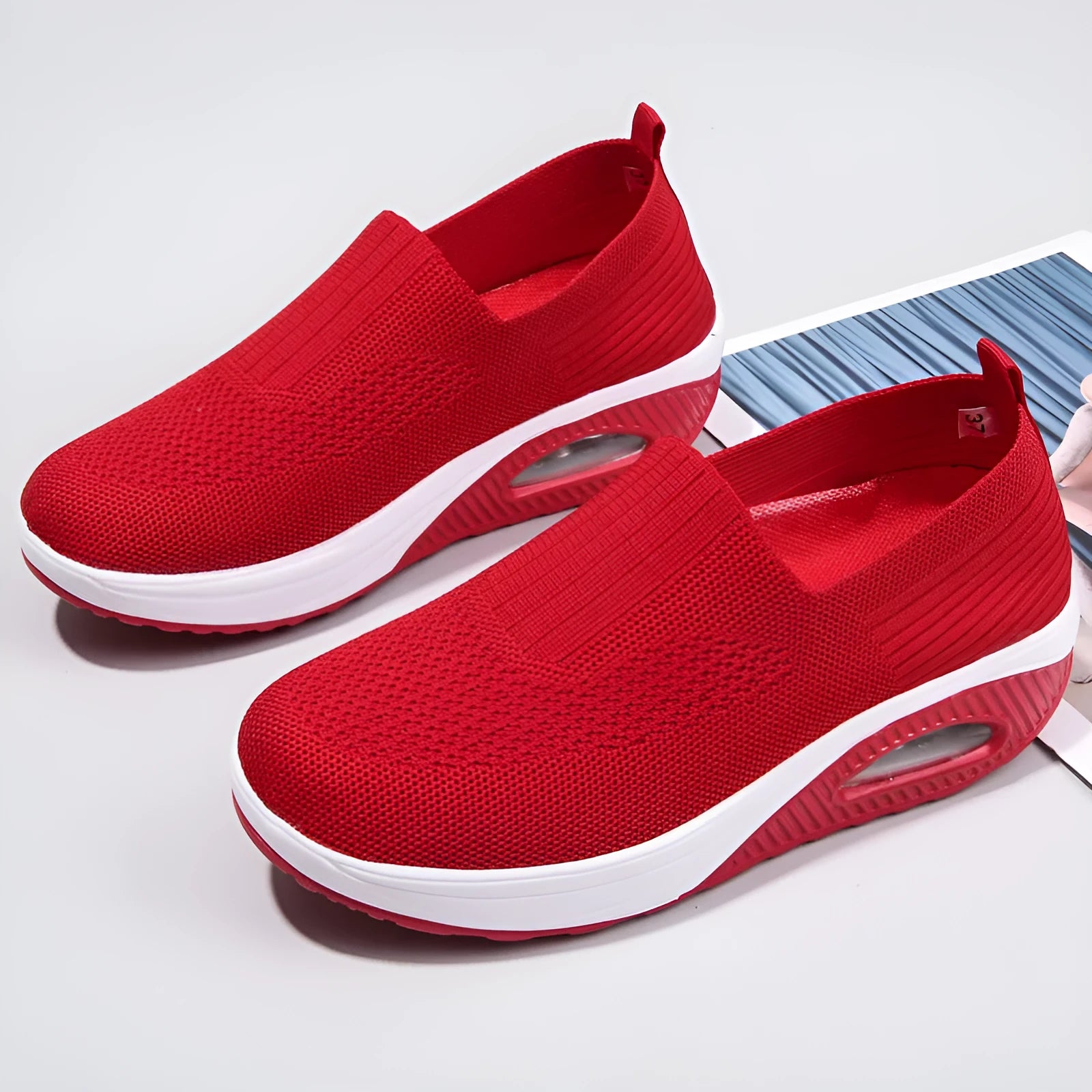 Women's mesh running shoes in beige with round toe and air cushion sole.