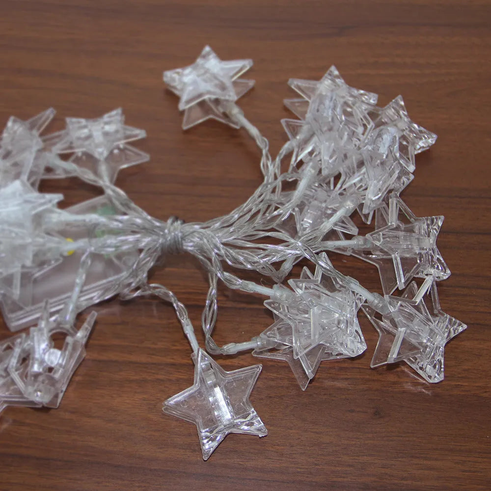 LED star clip festoon lights on a dark background showing warm white 3-metre string with 20 star-shaped lamps