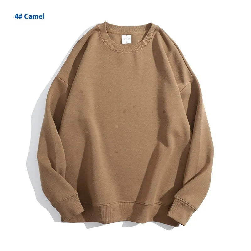 Loose-fitting, cotton, off-shoulder knit sweater in a solid colour on a hanger.