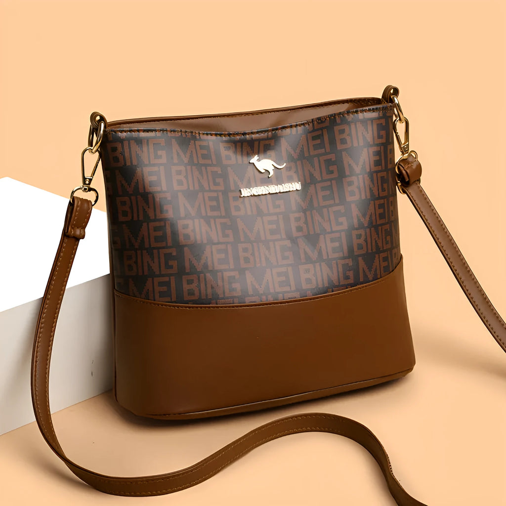 Brown soft leather messenger bag with front pocket and shoulder strap