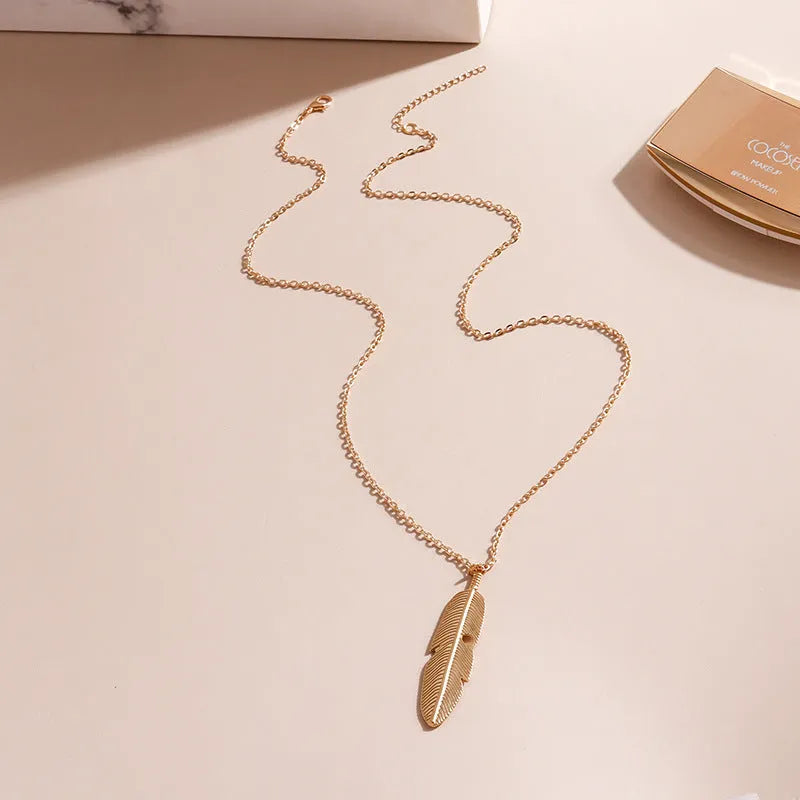 Retro feather tassel necklace for women in gold silver alloy with leaf geometry