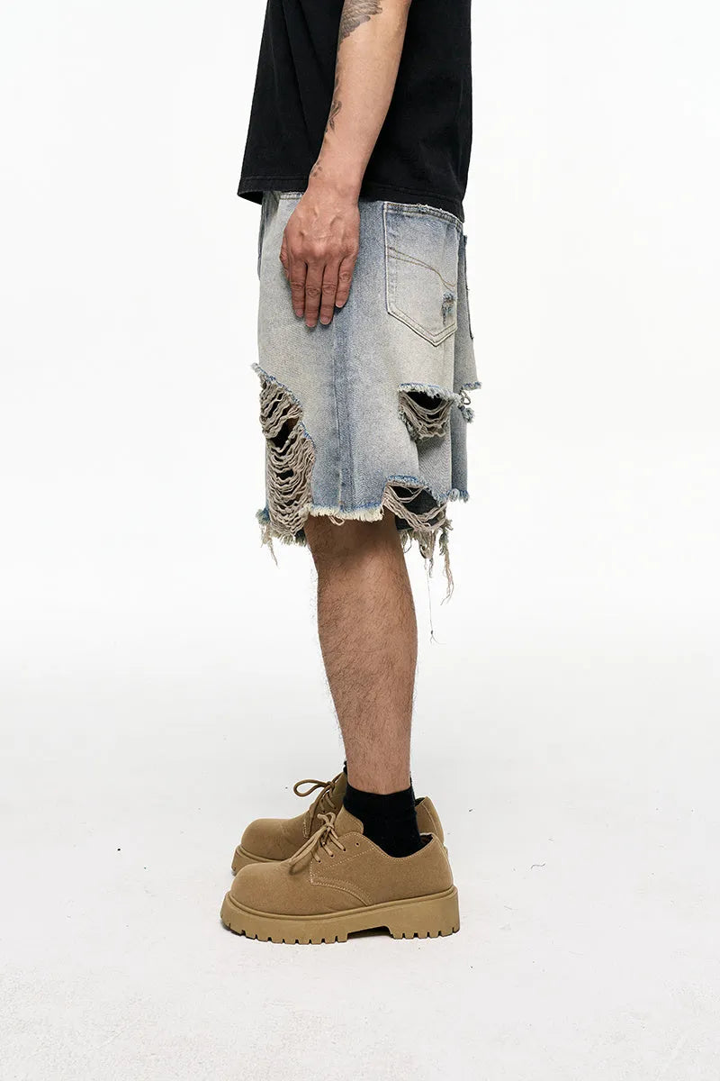 Light blue men's baggy retro denim shorts on a mid waist, showing wide leg and fifth pants length
