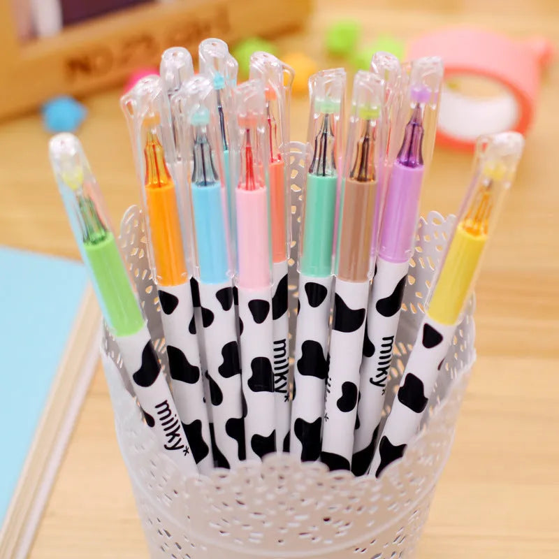 Cow pattern gel pen set showing 12 coloured pens with 0.38mm fine tips