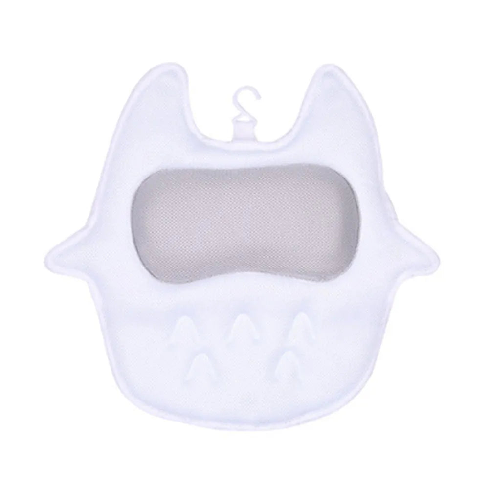 White ergonomic bathtub pillow with owl shape, 5D mesh fabric, and strong suction cups on a smooth bath surface