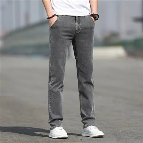 Men's straight-leg jeans in smoky grey colour with low waist design and zipper fly closure