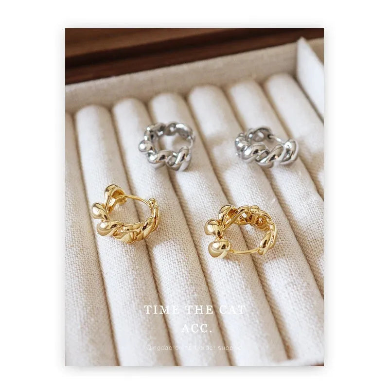 Pair of retro geometric round copper earrings with electroplated 18K gold or white gold finish for women.